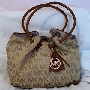 A brown and beige AUTHENTIC Michael Kors purse